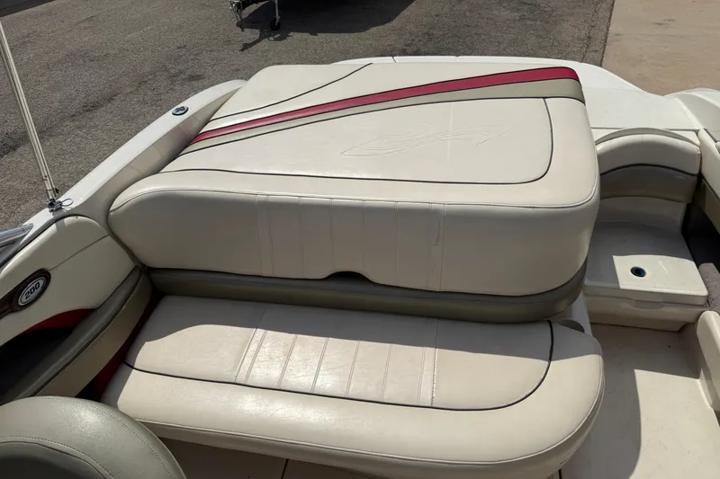 Slide: The Image of 2004 Sea Ray 200 Select boat interior with beige and red upholstery. - 22