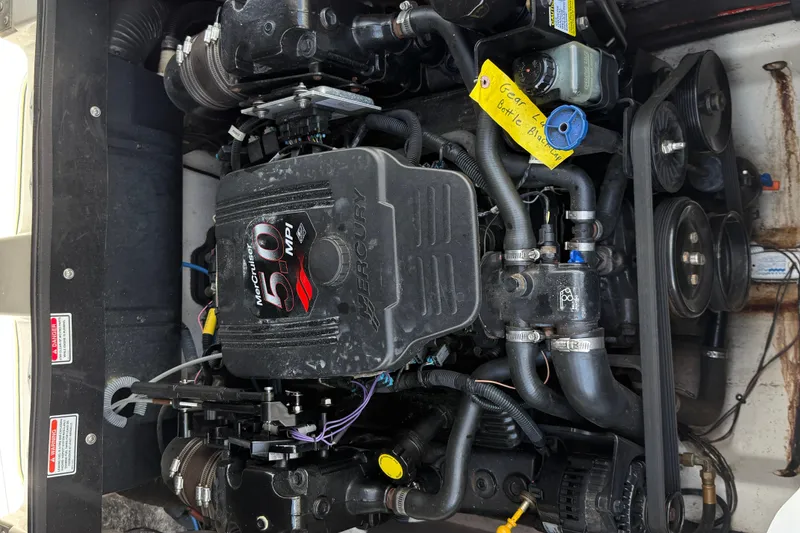 Slide: The Image of Engine of a 2004 Sea Ray 200 Select boat, featuring a MerCruiser 5.0 MPI. - 23