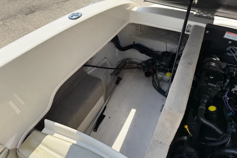 Slide: The Image of 2004 Sea Ray 200 Select engine compartment with visible components and wiring. - 24