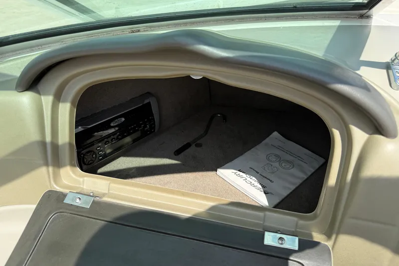 Slide: The Image of 2004 Sea Ray 200 Select glove compartment with stereo and manual. - 29