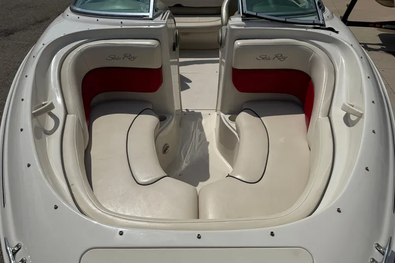 Slide: The Image of 2004 Sea Ray 200 Select boat interior with white and red seating. - 8