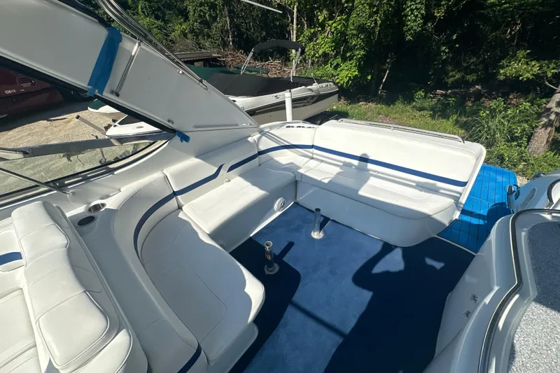 Slide: The Image of 2007 Formula 400 Super Sport boat interior with white seating and blue carpet. - 11