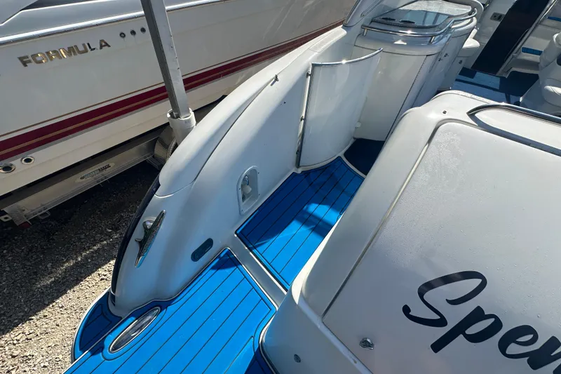 Slide: The Image of 2007 Formula 400 Super Sport boat with blue deck and sleek design. - 13