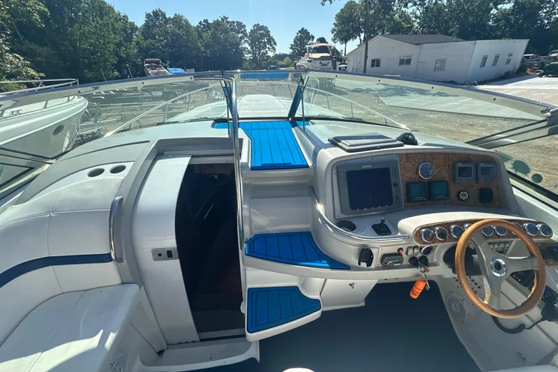 Slide: The Image of 2007 Formula 400 Super Sport boat cockpit with blue accents and steering wheel. - 16
