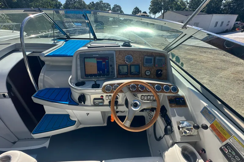 Slide: The Image of 2007 Formula 400 Super Sport boat cockpit with steering wheel and navigation instruments. - 18