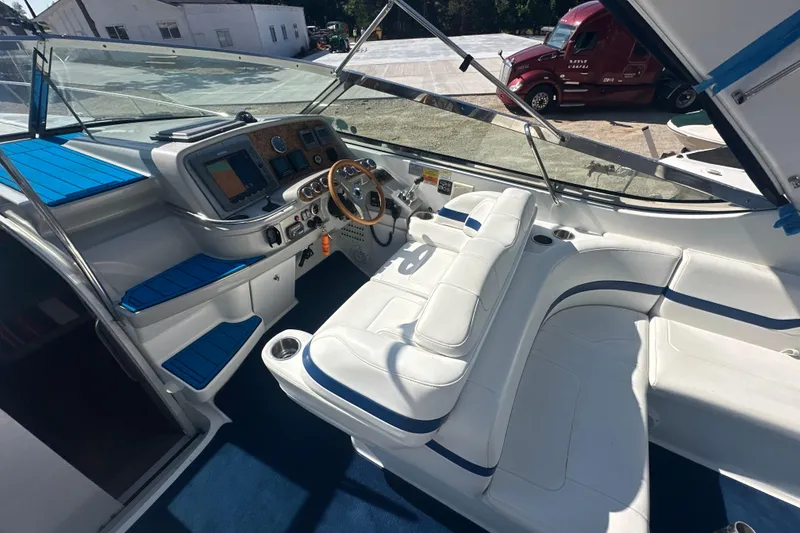 Slide: The Image of 2007 Formula 400 Super Sport boat interior with white seating and control panel. - 19