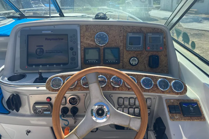 Slide: The Image of Dashboard of a 2007 Formula 400 Super Sport boat with navigation and control instruments. - 21