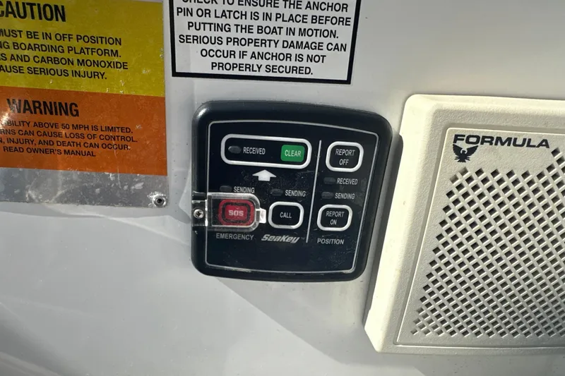 Slide: The Image of Control panel and warning labels on a 2007 Formula 400 Super Sport boat. - 24