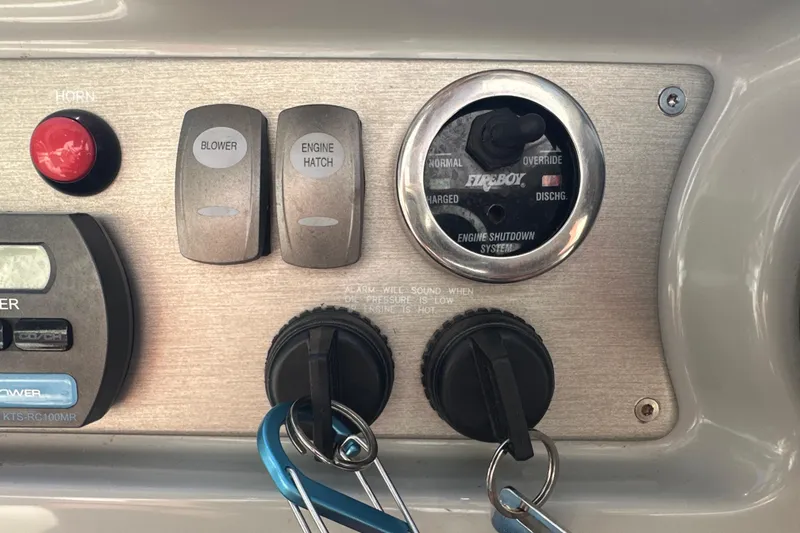 Slide: The Image of Control panel of a 2007 Formula 400 Super Sport boat with switches and keys. - 25