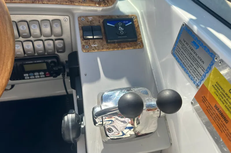 Slide: The Image of 2007 Formula 400 Super Sport boat controls with switches and certification plaque. - 29