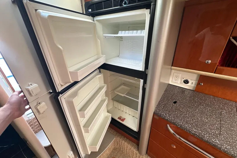Slide: The Image of Open refrigerator in 2007 Formula 400 Super Sport boat kitchen interior. - 35