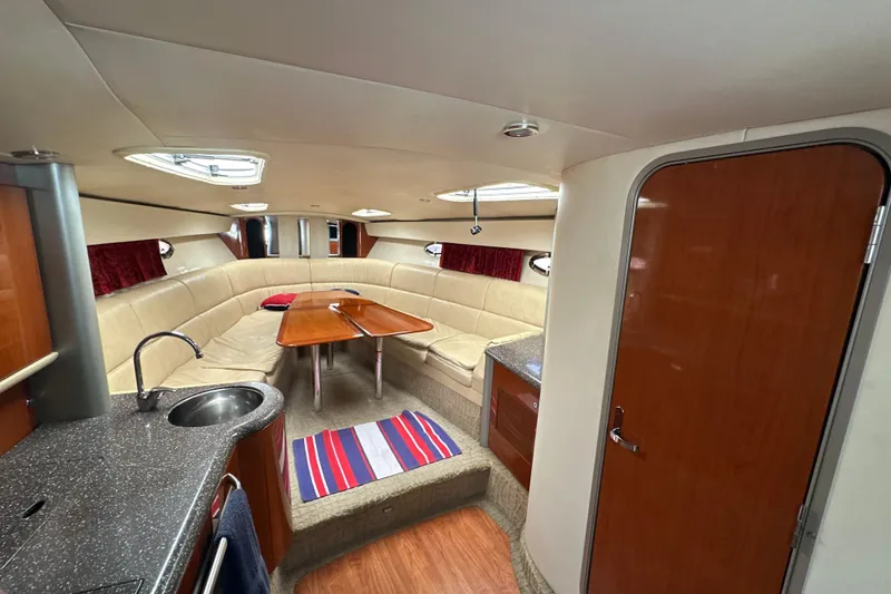 Slide: The Image of 2007 Formula 400 Super Sport yacht interior with seating, table, and kitchenette. - 39
