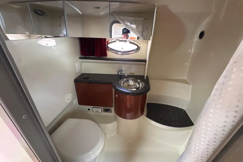 Slide: The Image of 2007 Formula 400 Super Sport yacht bathroom with sink, toilet, and mirror. - 40
