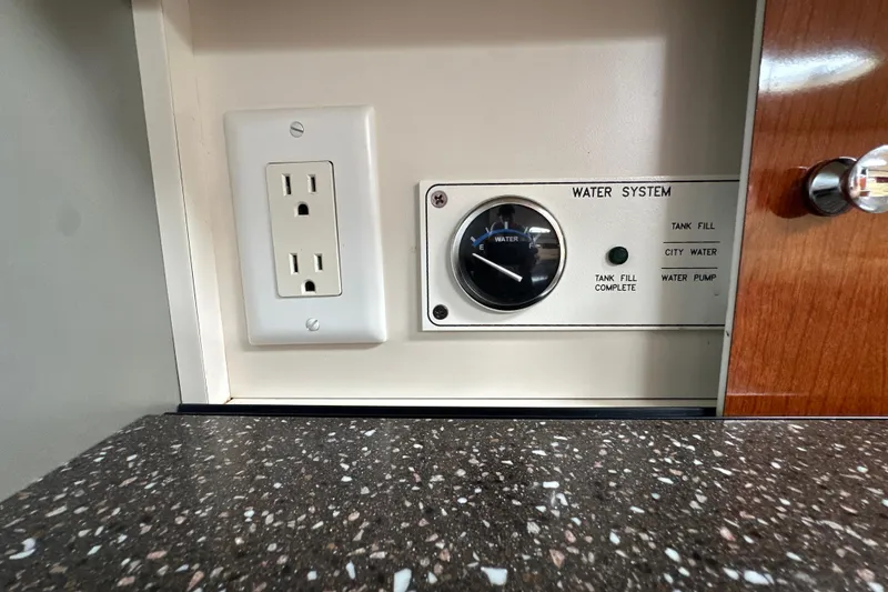 Slide: The Image of Water system control panel and outlet in 2007 Formula 400 Super Sport boat. - 45