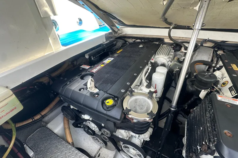 Slide: The Image of Engine compartment of a 2007 Formula 400 Super Sport boat, showcasing mechanical components. - 48