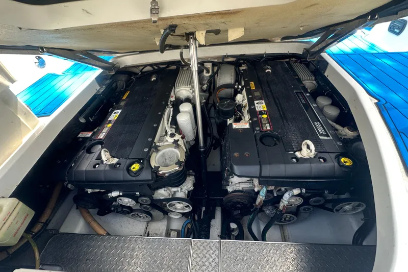 Slide: The Image of Engine compartment of a 2007 Formula 400 Super Sport boat, showcasing dual engines. - 49