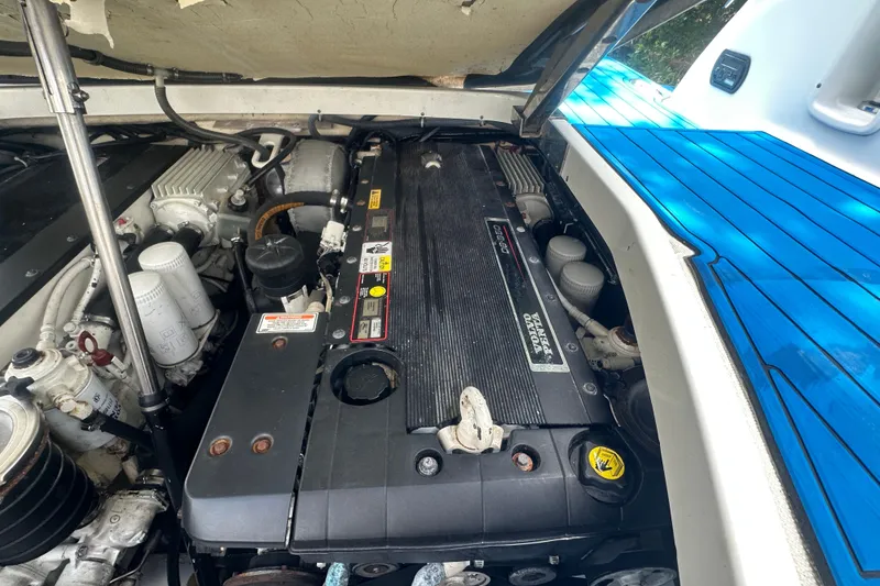 Slide: The Image of Engine compartment of a 2007 Formula 400 Super Sport boat, showcasing detailed components. - 50