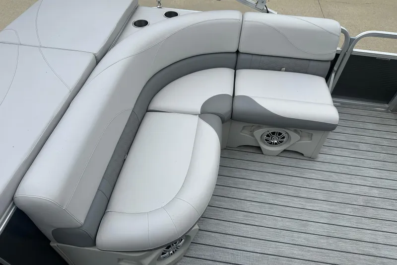 Slide: The Image of Luxurious seating on 2018 Avalon GS2185 boat with integrated speakers and cup holders. - 13