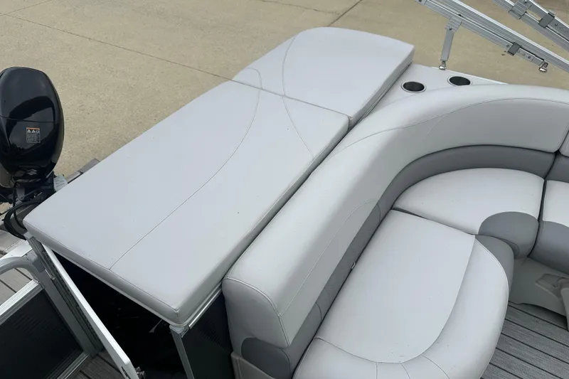 Slide: The Image of 2018 Avalon GS2185 boat interior with gray seating and cup holders. - 14