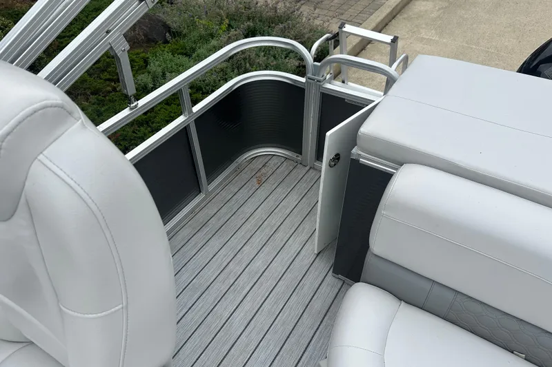 Slide: The Image of 2018 Avalon GS2185 boat interior with white seating and open gate. - 15