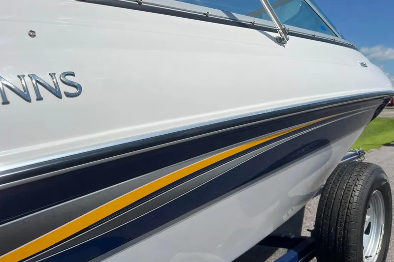 Slide: The Image of 2008 Four Winns H190 boat with sleek design and vibrant stripe detailing. - 17