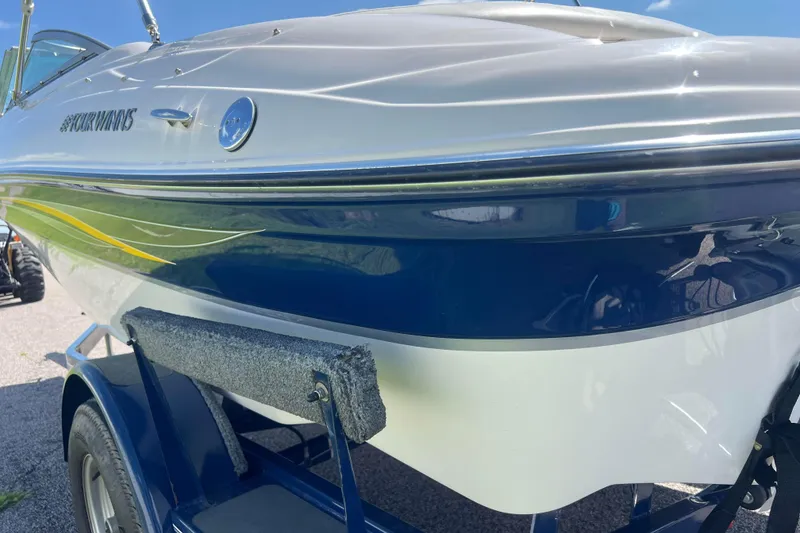 Slide: The Image of 2008 Four Winns H190 boat on trailer, showcasing sleek design and vibrant colors. - 32