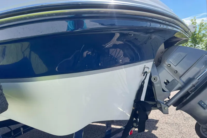 Slide: The Image of 2008 Four Winns H190 boat stern with outboard motor, blue and white hull. - 33