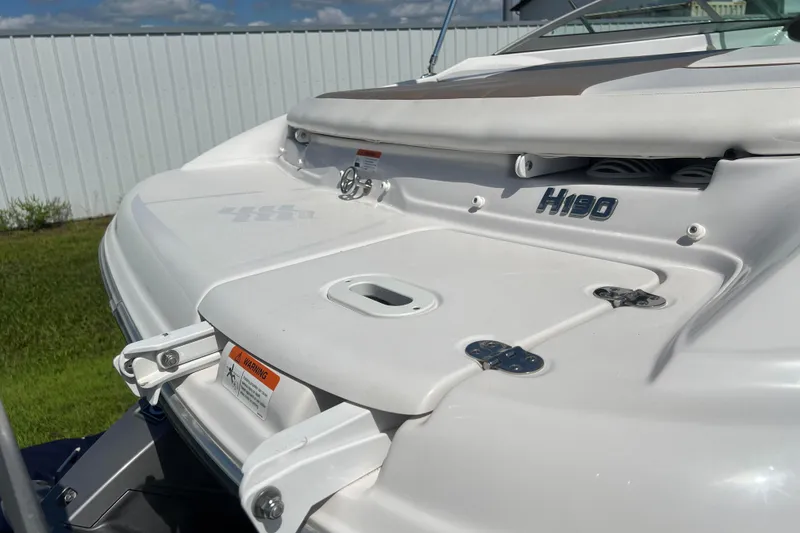 Slide: The Image of 2008 Four Winns H190 boat stern with swim platform and ladder, under clear sky. - 34