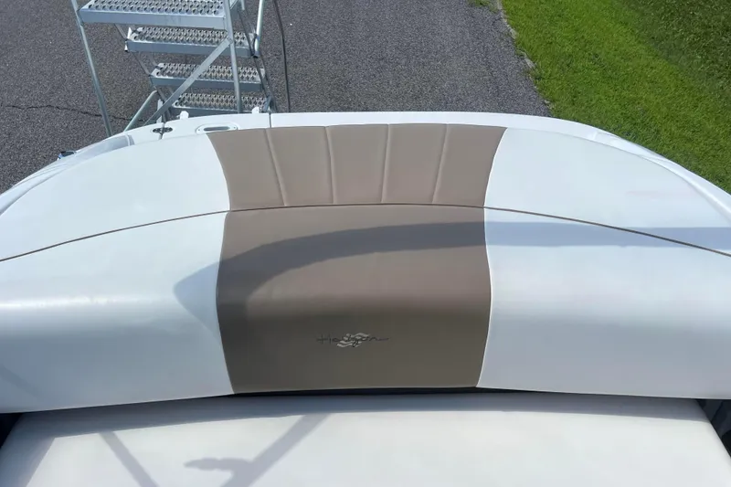 Slide: The Image of 2008 Four Winns H190 boat interior with beige and white upholstery. - 36