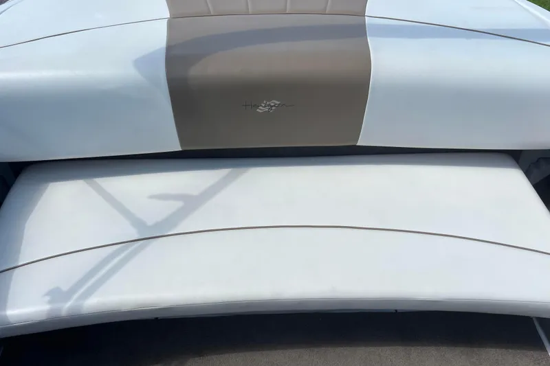 Slide: The Image of 2008 Four Winns H190 boat seat with white and beige upholstery. - 37