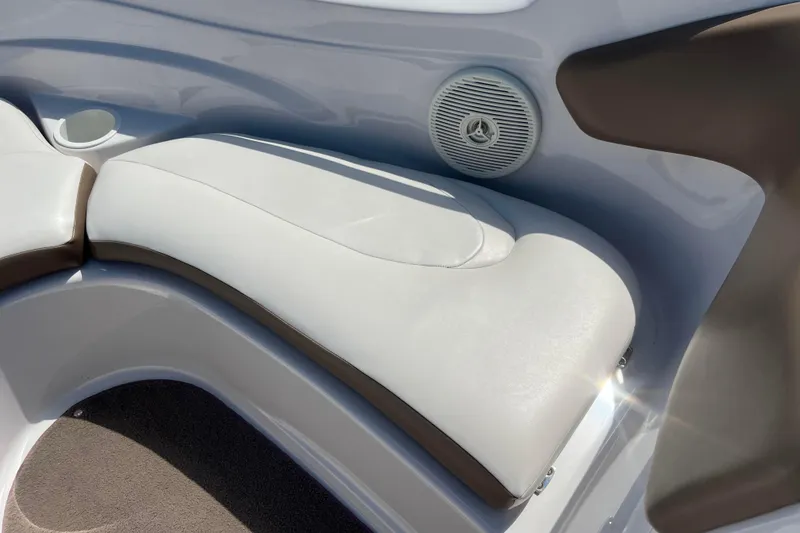 Slide: The Image of 2008 Four Winns H190 boat interior with white seating and speaker detail. - 48