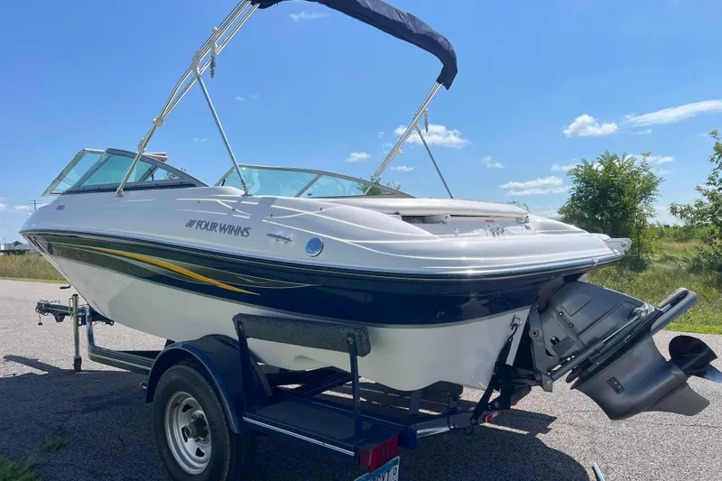 Slide: The Image of 2008 Four Winns H190 boat on trailer under clear blue sky. - 5