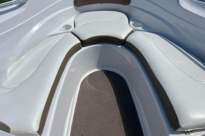 Slide: The Image of Interior seating of 2008 Four Winns H190 boat with white and brown upholstery. - 51
