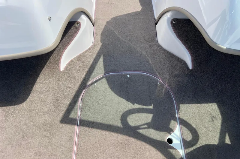 Slide: The Image of Interior view of a 2008 Four Winns H190 boat, featuring carpeted flooring and sleek design elements. - 52