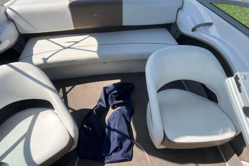 Slide: The Image of Interior of 2008 Four Winns H190 boat with white seating and blue fabric. - 57