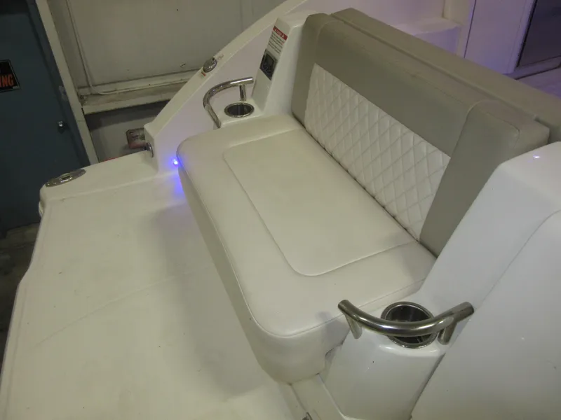 Slide: The Image of Luxurious seating area on a 2017 Chaparral 330 Signature boat with ambient lighting. - 12