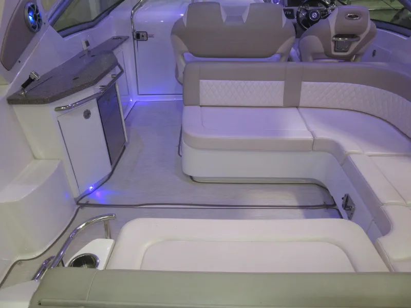 Slide: The Image of Luxurious interior of 2017 Chaparral 330 Signature boat with plush seating and modern amenities. - 14