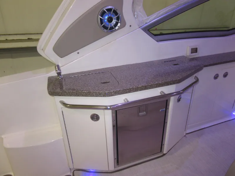 Slide: The Image of 2017 Chaparral 330 Signature interior with safety warning and control panel. - 17