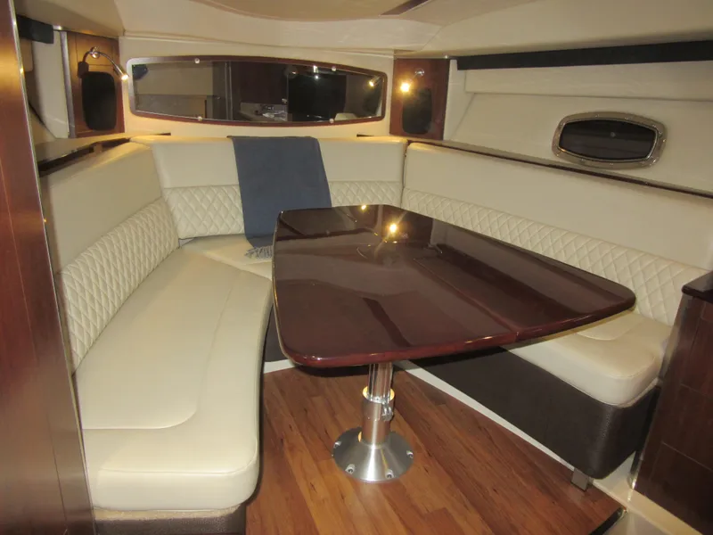 Slide: The Image of 2017 Chaparral 330 Signature boat interior with plush seating and modern dashboard. - 21