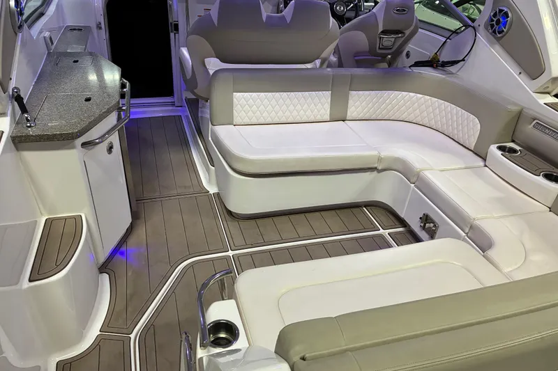 Slide: The Image of 2017 Chaparral 330 Signature boat interior with luxurious seating and modern dashboard. - 31
