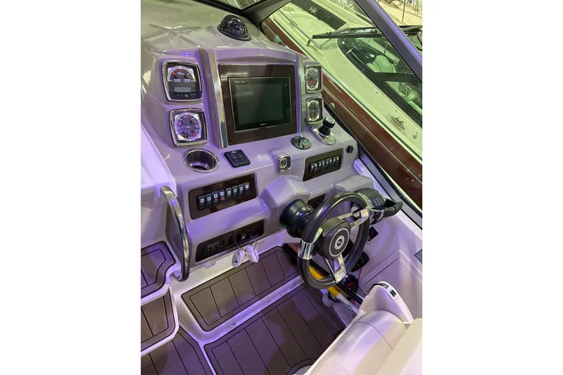Slide: The Image of 2017 Chaparral 330 Signature boat interior with elegant seating and wood-style flooring. - 33