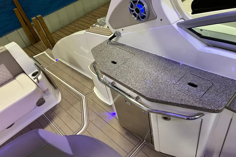 Slide: The Image of Luxury seating on 2017 Chaparral 330 Signature boat, featuring elegant white upholstery. - 37