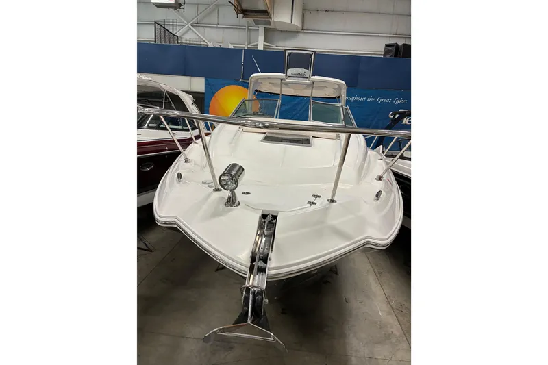 Slide: The Image of 2017 Chaparral 330 Signature boat interior with sleek seating and modern kitchenette. - 38