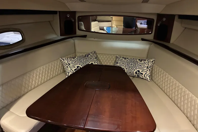 Slide: The Image of 2017 Chaparral 330 Signature yacht interior kitchen with wood cabinets and modern appliances. - 42