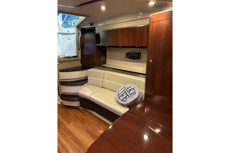 Slide: The Image of Luxurious interior of 2017 Chaparral 330 Signature yacht with elegant seating and wooden table. - 44