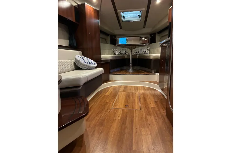 Slide: The Image of 2017 Chaparral 330 Signature yacht interior with elegant seating and wood finish. - 46