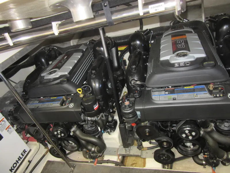 Slide: The Image of 2017 Chaparral 330 Signature boat helm with steering wheel and control panel. - 5