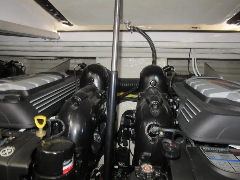 Slide: The Image of Three marine batteries with yellow and red cables in a 2017 Chaparral 330 Signature boat. - 8