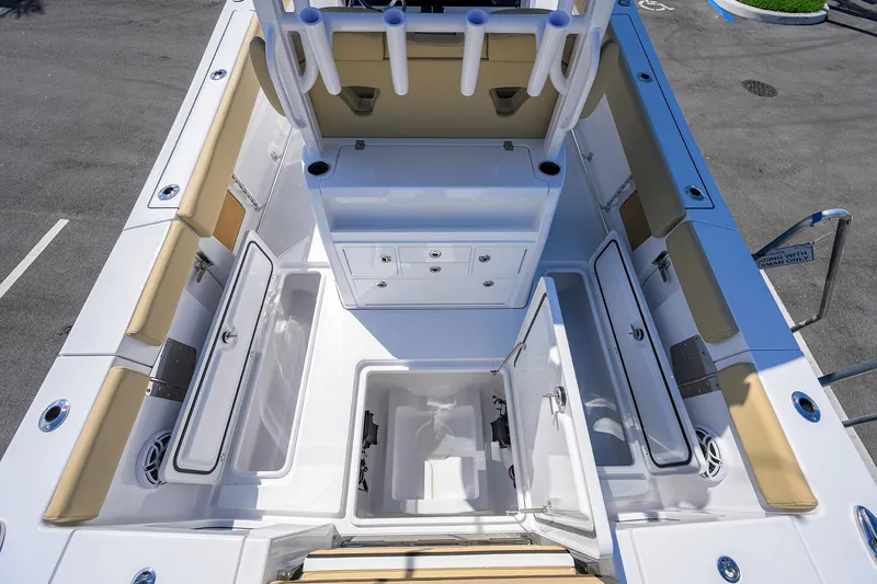 Slide: The Image of 2026 Sportsman Open 302 Center Console boat interior with storage compartments and seating. - 15