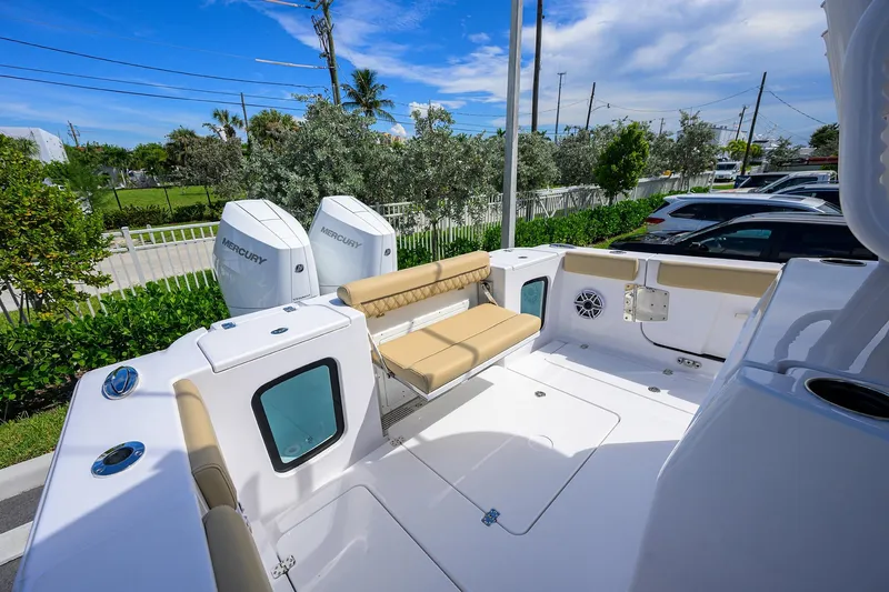 Slide: The Image of 2026 Sportsman Open 302 Center Console boat with Mercury engines, spacious seating, and modern design. - 18